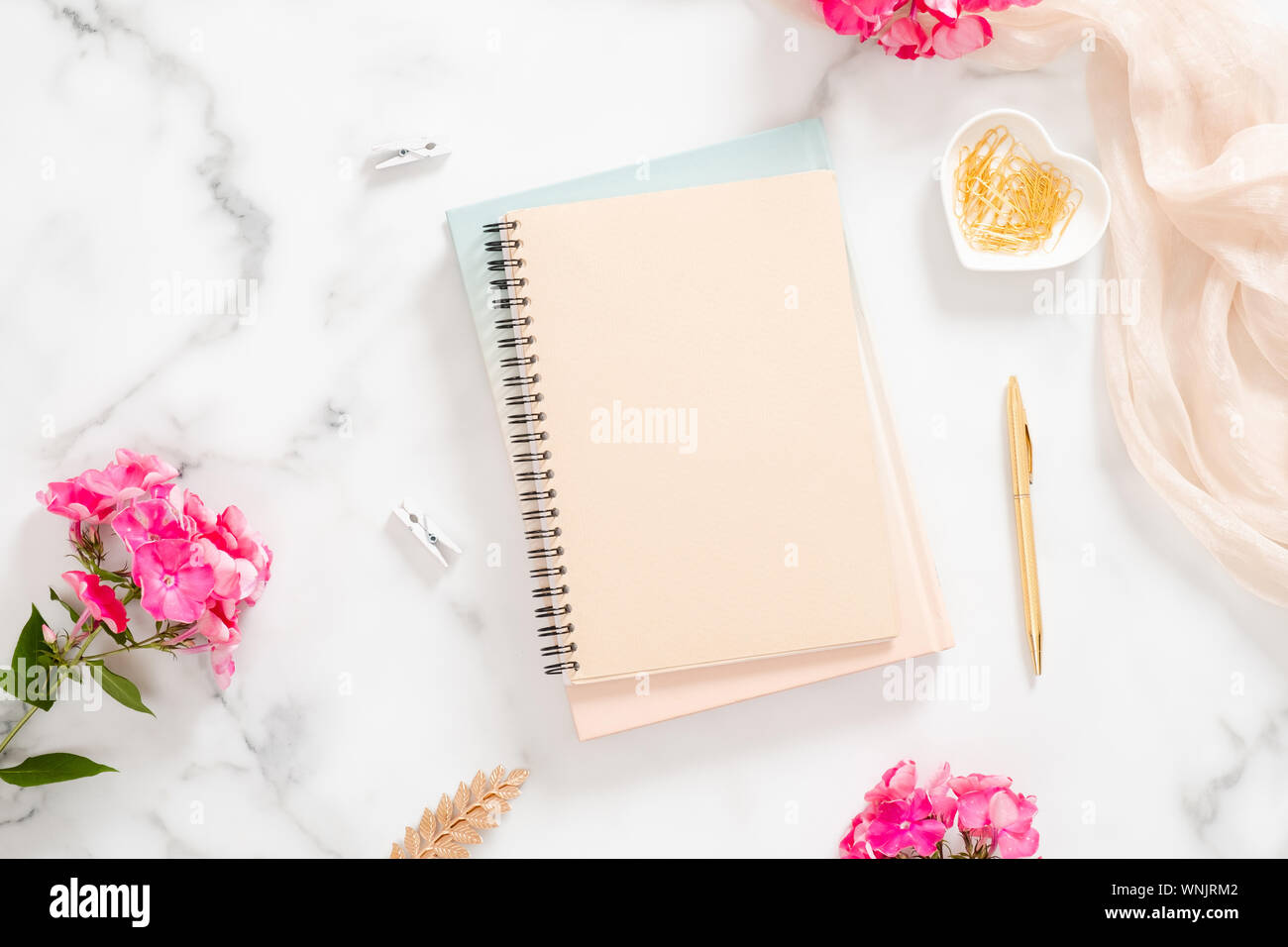 https www alamy com blank paper notebook pink flowers pastel blanket and golden accessories on marble background flat lay top view rose gold home office desk beauty image271477026 html