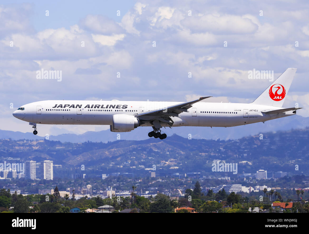 Los Angeles, California, USA - May 22, 2019: A Japan Airlines Boeing 777 lands at the Los Angeles International Airport (LAX). Stock Photo