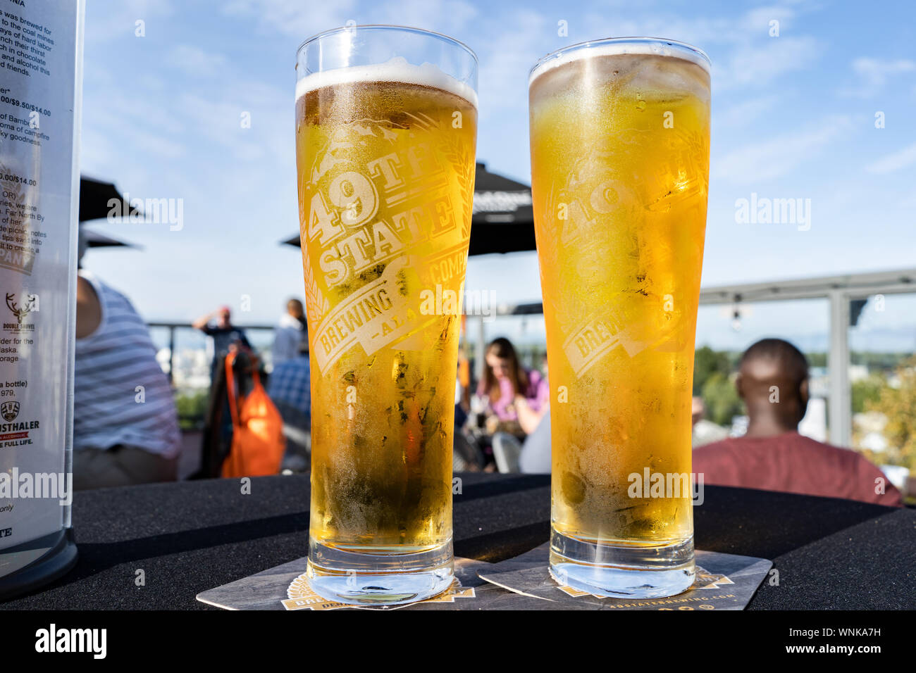 Cold beers at sunny rooftop bar Stock Photo