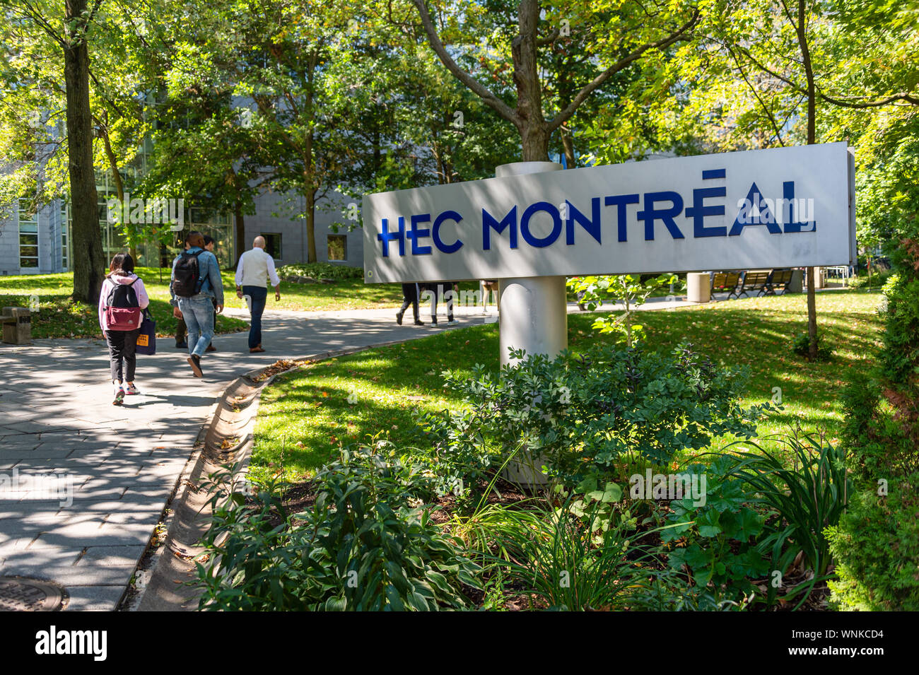 Montreal, CA - 5 September 2019: students passing by HEC Montreal sign Stock Photo