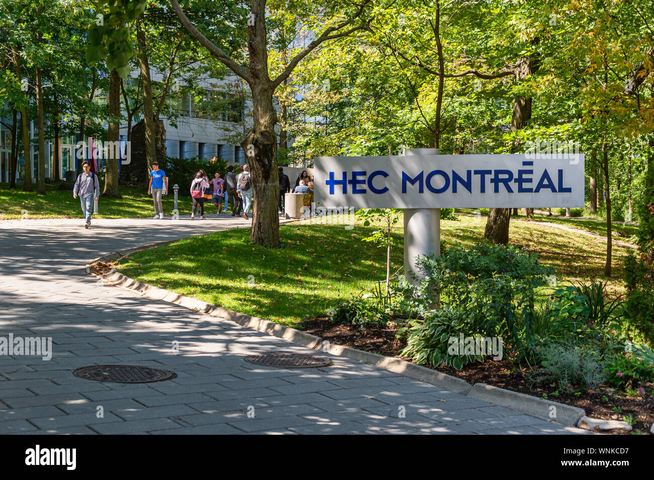 Montreal, CA - 5 September 2019: students passing by HEC Montreal sign Stock Photo