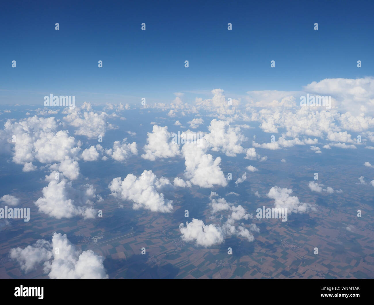 blue sky with clouds seen from plane useful as a background Stock Photo ...