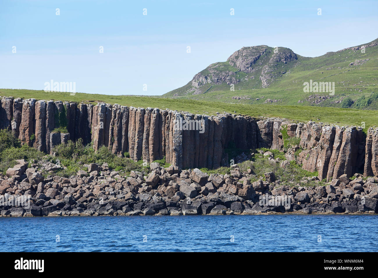 Basalt rock columns seen from Loch Na Keal on the Isle of Mull, Inner Hebrides, Scotland, UK Stock Photo