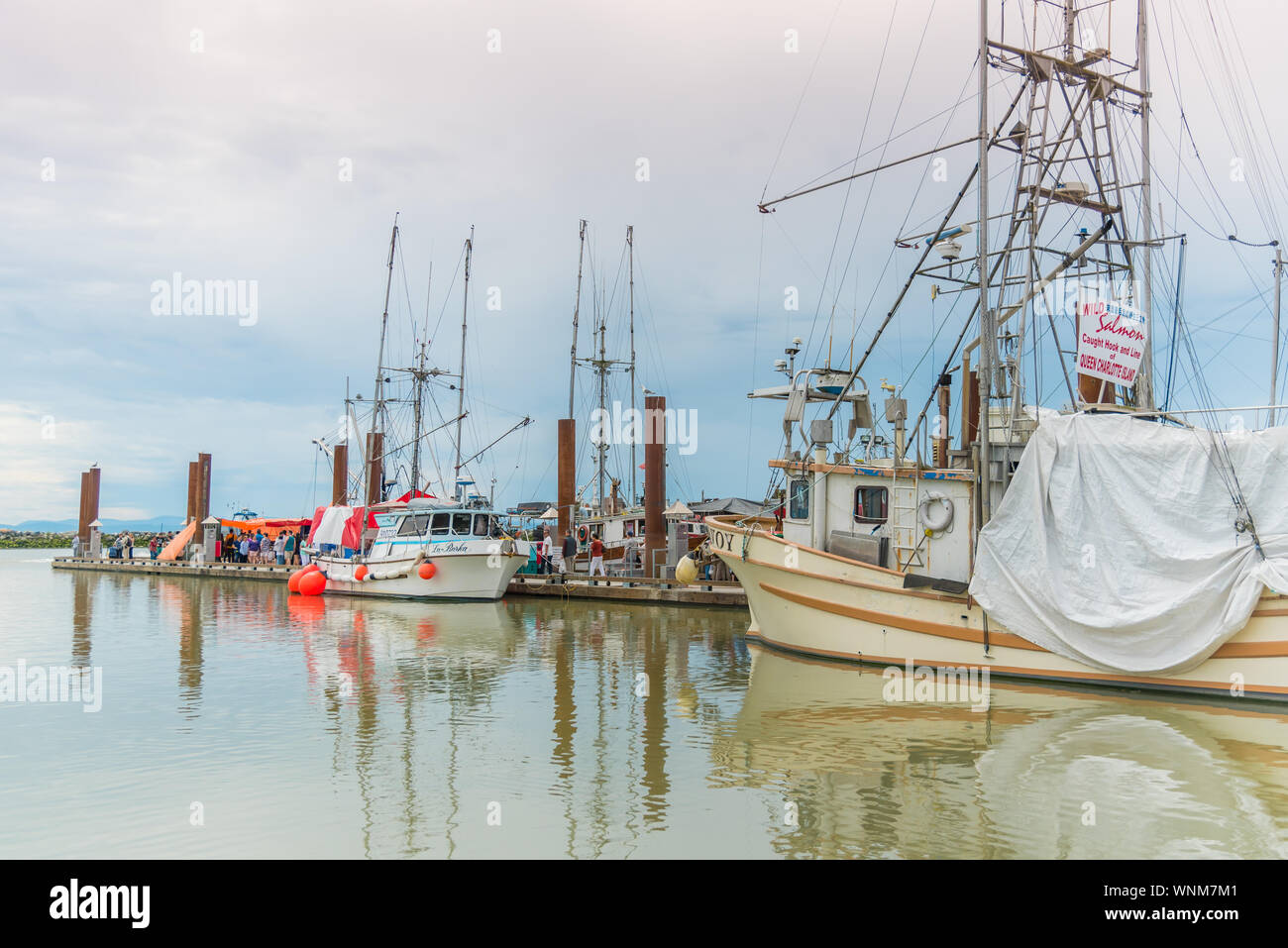 Steveston, British Columbia/Canada - June 24, 2018: fishing boats docked at Fisherman's Wharf, selling freshly caught seafood to tourists and locals. Stock Photo
