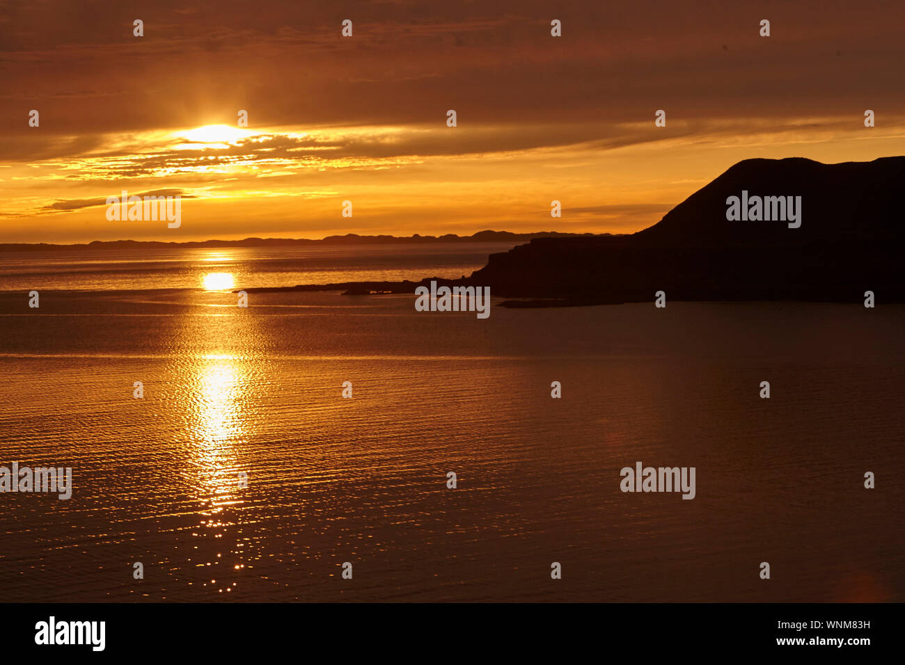 Sunset over Loch Tauth Laggan Bay, Isle of Mull, Scotland, UK. Stock Photo