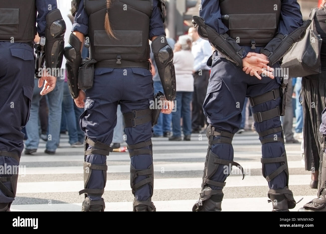 Standing uniform security guard authority hi-res stock photography and ...