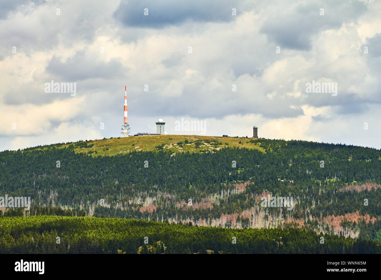 Tower On Mountain Against Cloudy Sky At Harz National Park In Saxony-anhalt Stock Photo