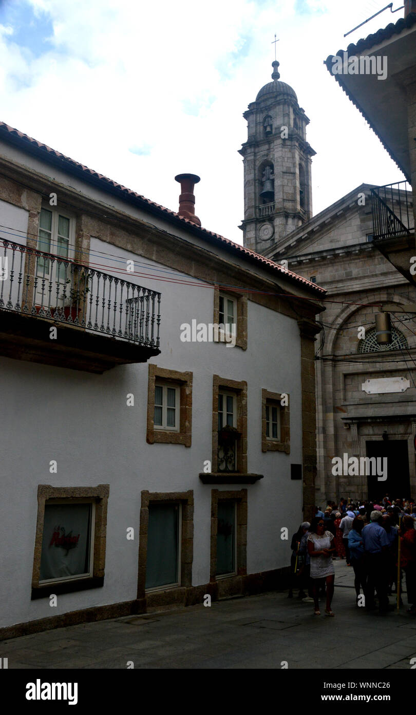 People Leaving the Collegiate Church of Saint Maria in the Old Town of Vigo, North West Spain, EU. Stock Photo