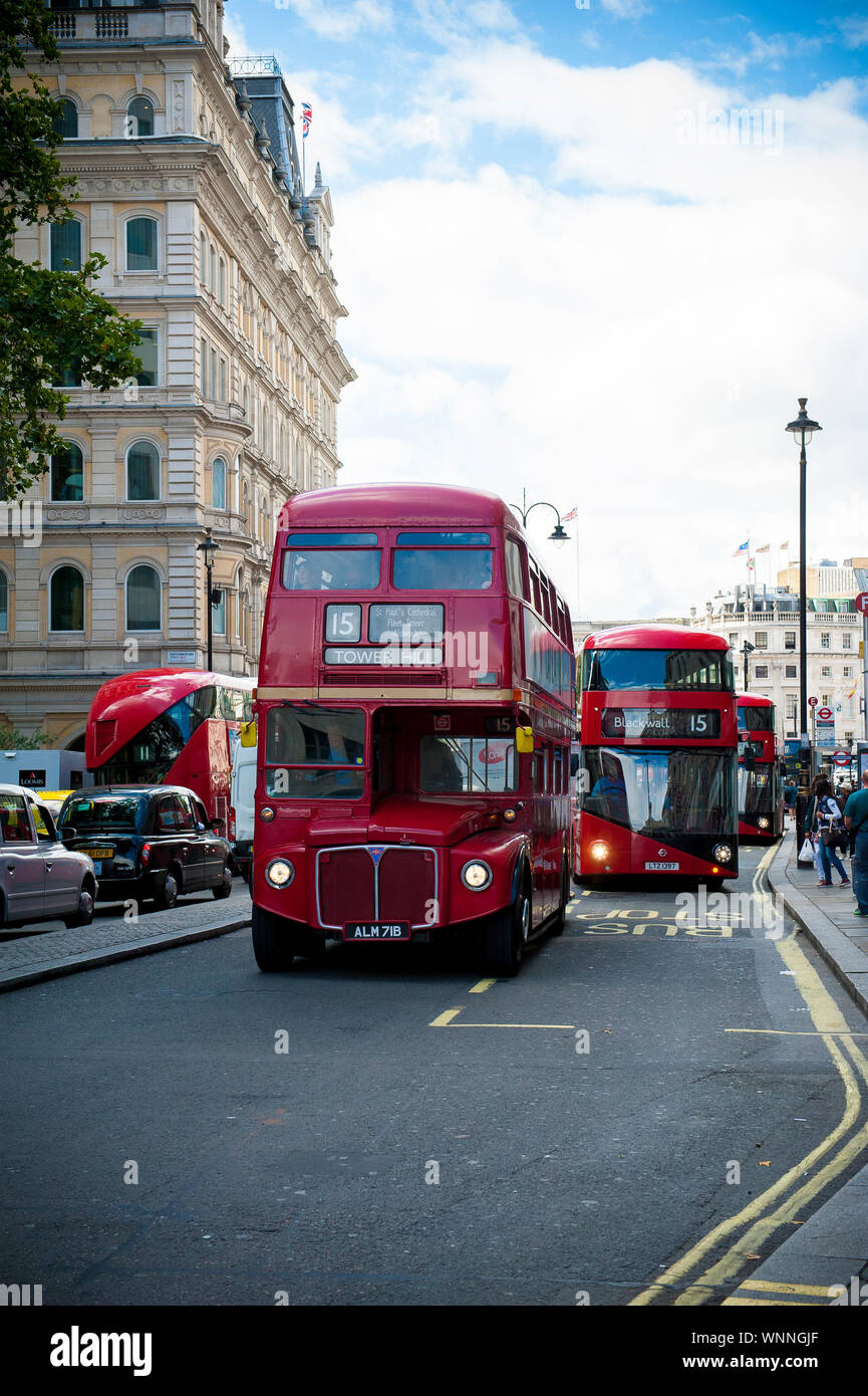 Number 15 bus both electric and route master london buses Stock Photo