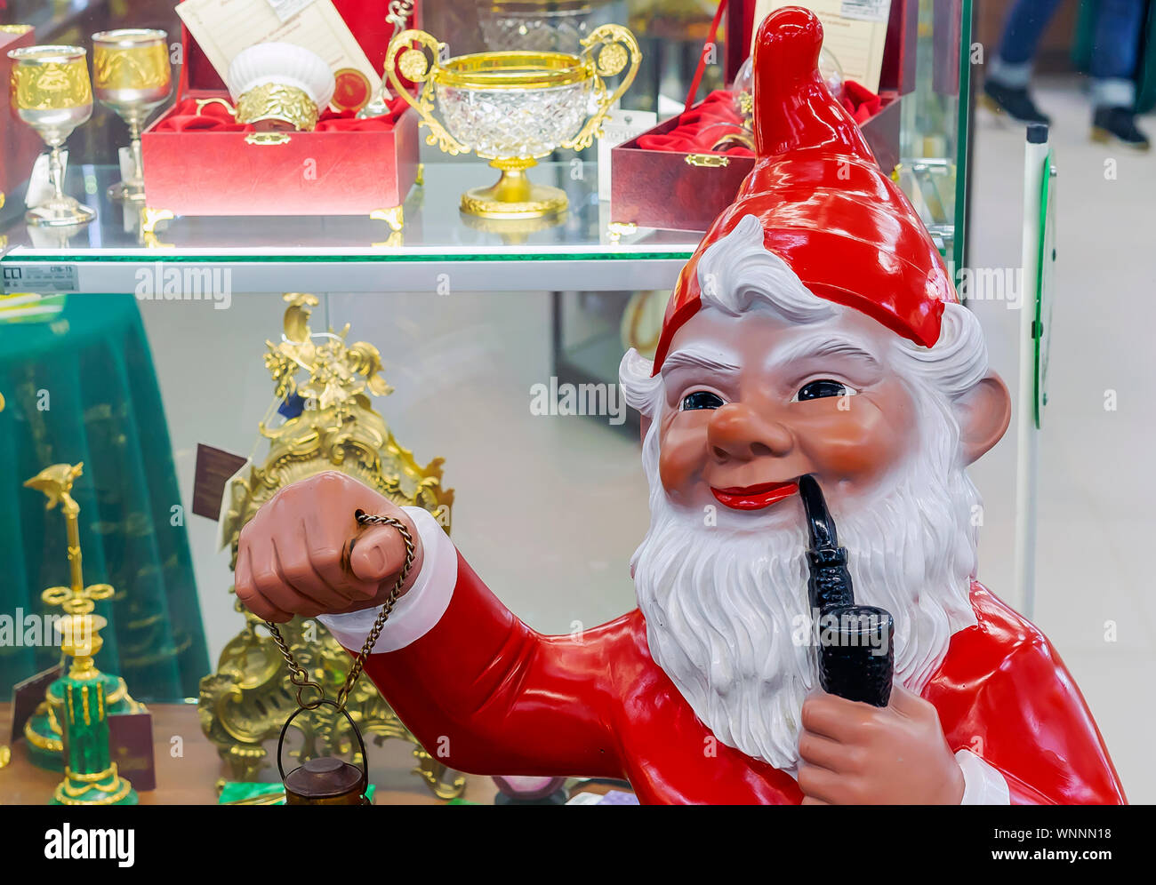 The colourful gnome with a lantern and a smoking pipe Stock Photo Alamy