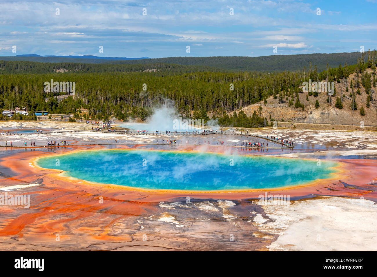 Grand Prismatic Spring, the largest hot spring at Yellowstone National Park, is 200-330 feet in diameter and more than 121 feet deep. Stock Photo