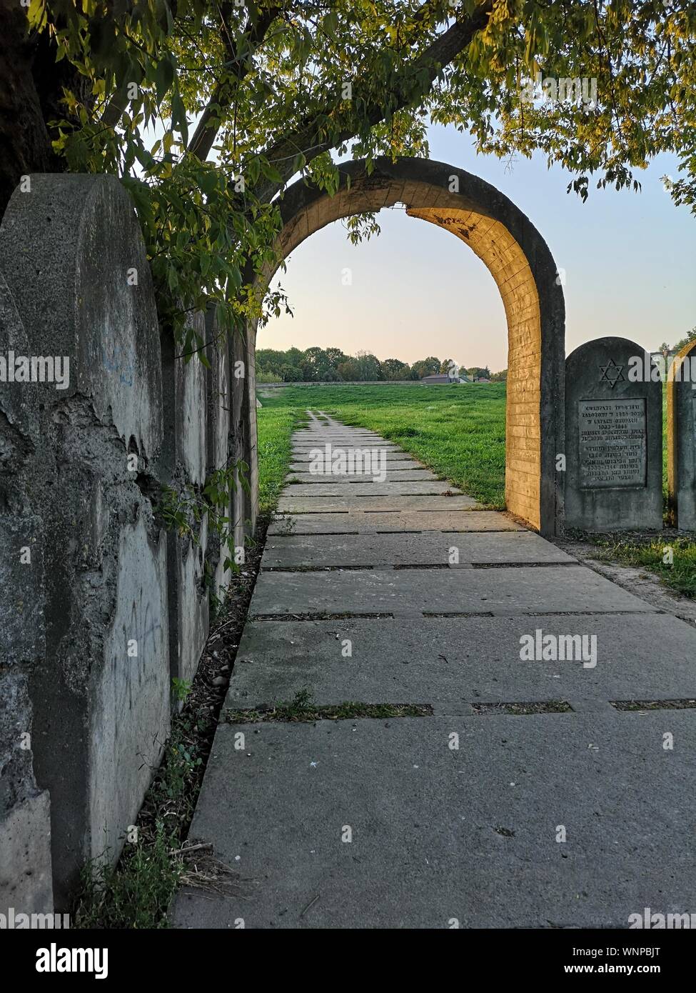 remains of an old Jewish cemetery with an entrance gate Stock Photo