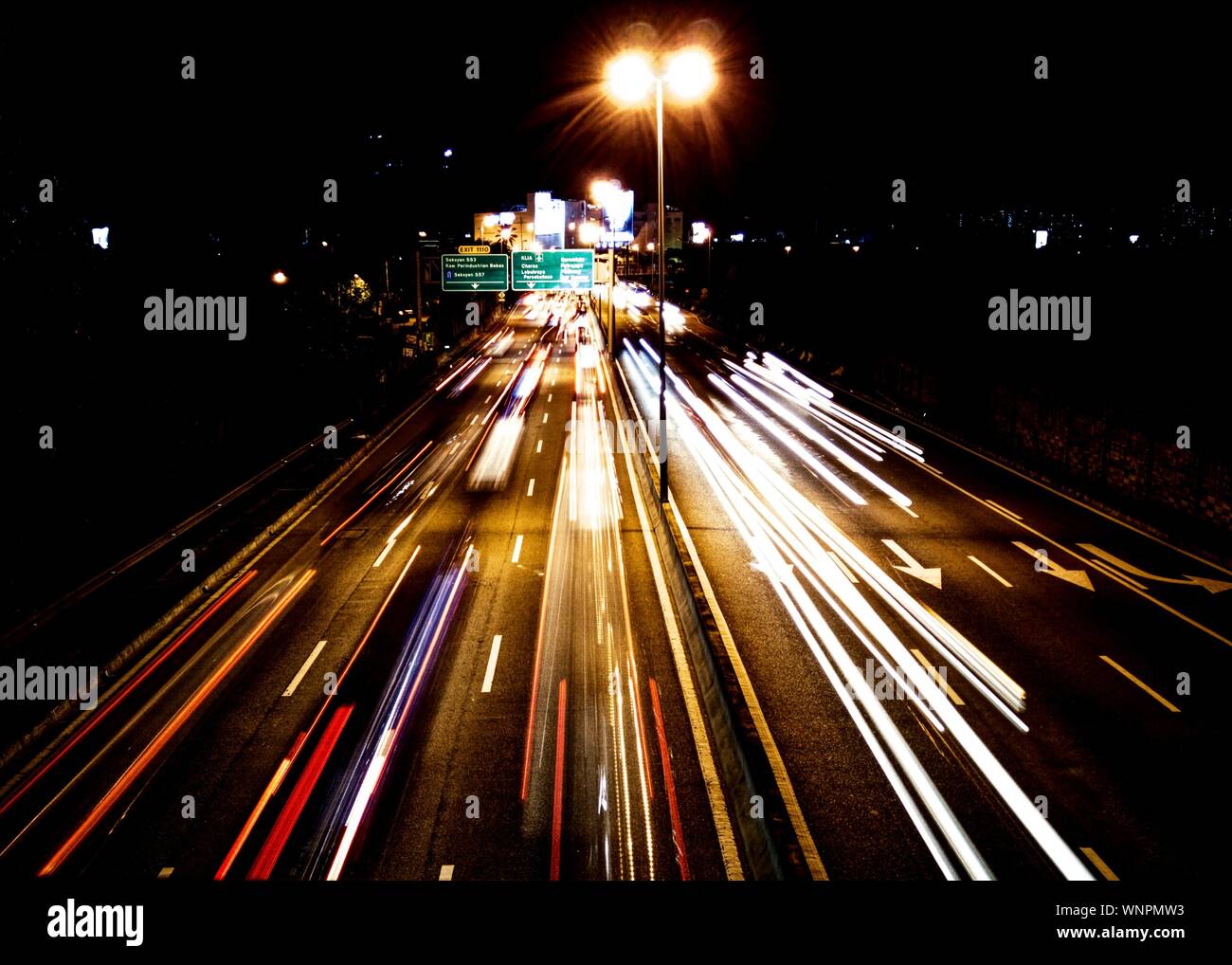 Blurred Motion Of Traffic Lights On Road At Night Stock Photo Alamy
