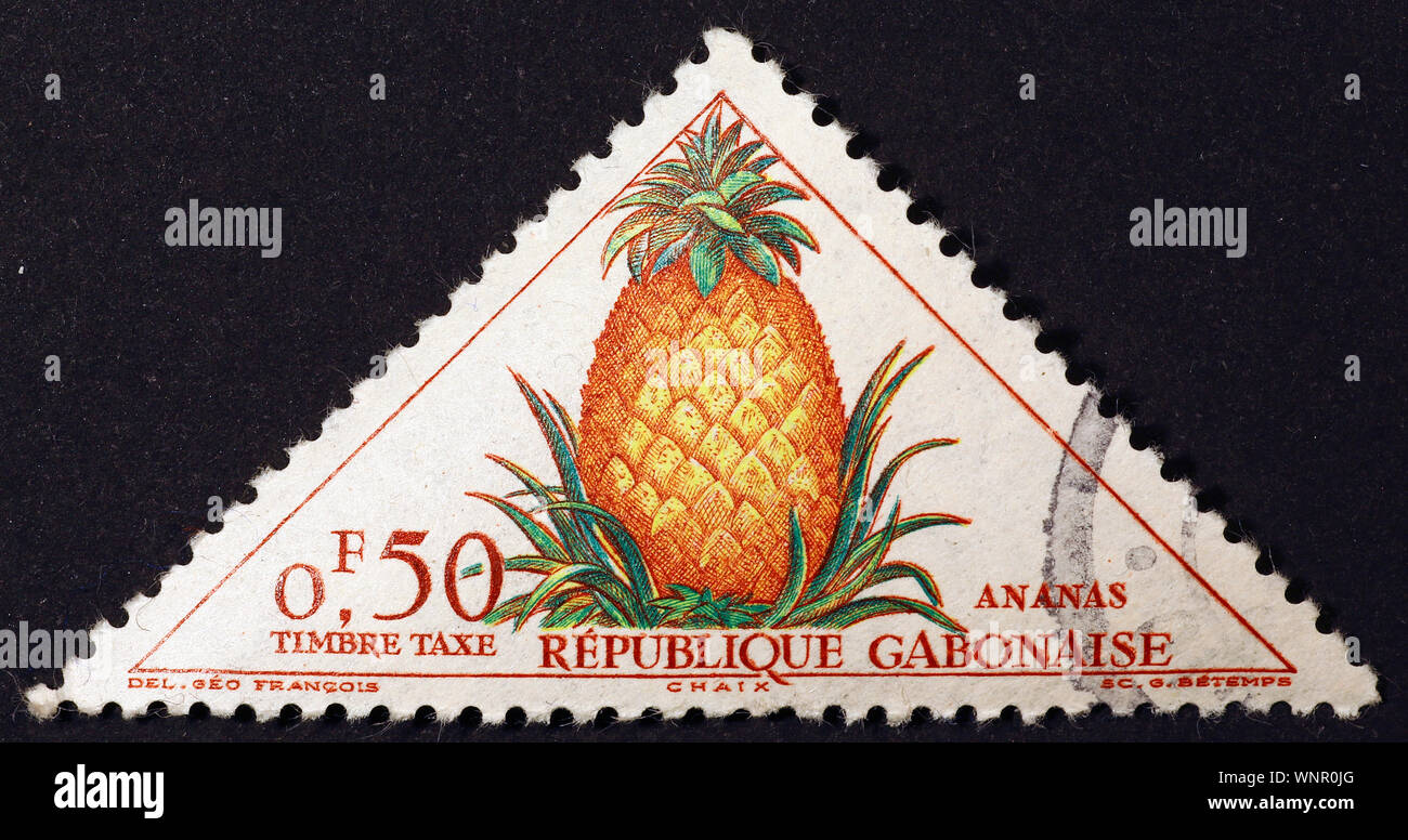 Pineapple on triangular postage stamp of Gabon Stock Photo