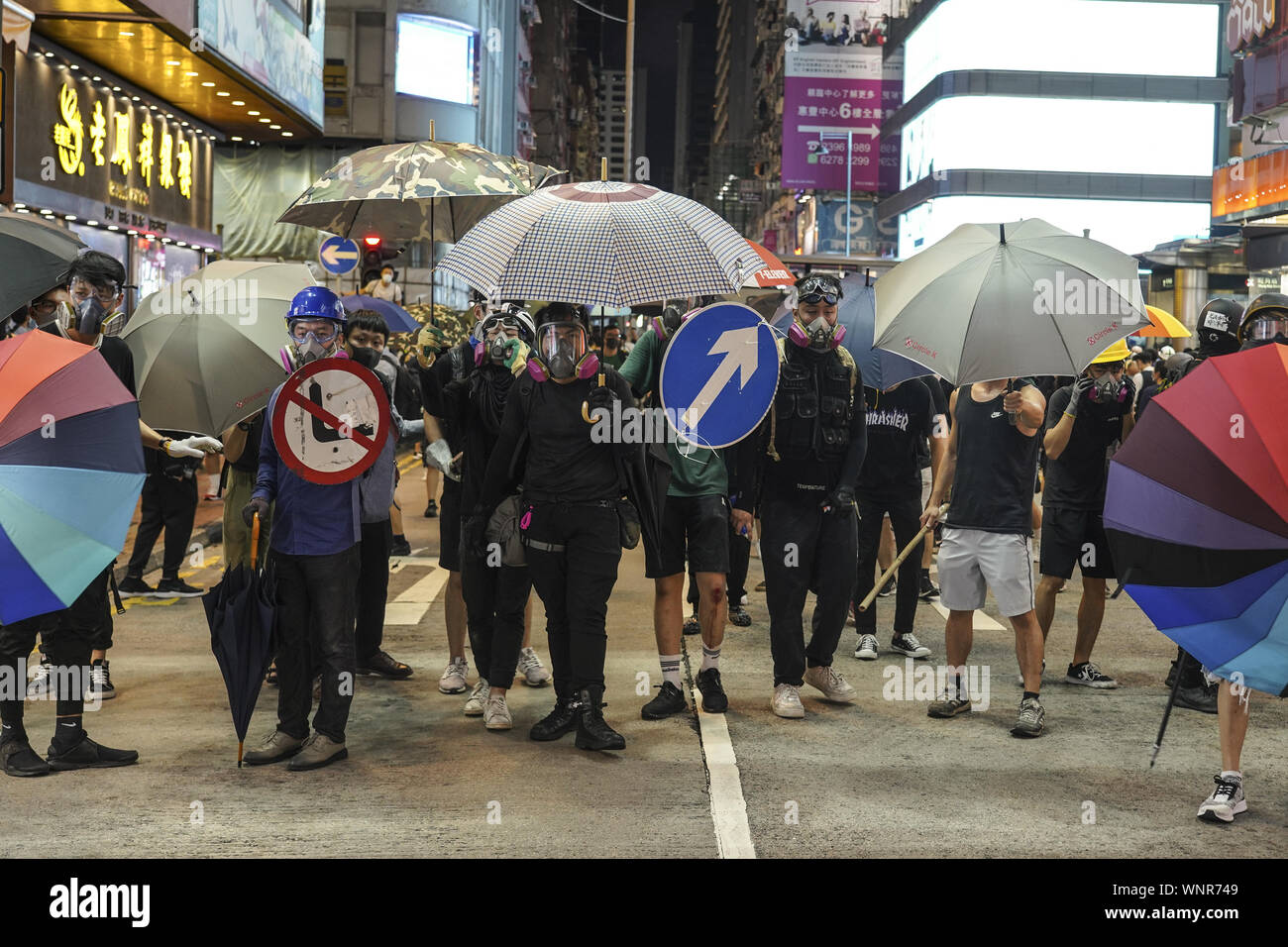 Kowloon, Hong Kong. 6th Sep, 2019. Protesters filled Nathan Rd as they confront police force on Friday September 6, 2019.in Mong Kok Town Kowloon, Hong Kong.Thousands of protestors gathered outside of Mong Kok police station and around that area to protest the police violence against citizens of Hong Kong.Protesters Moved Nathan Rd to south, destroying surveillance cameras, street signs, building barricades with wooden panes and garbages then set on fire as they move on.9/6/2019.Kowloon, Hong Kong. Credit: ZUMA Press, Inc./Alamy Live News Stock Photo