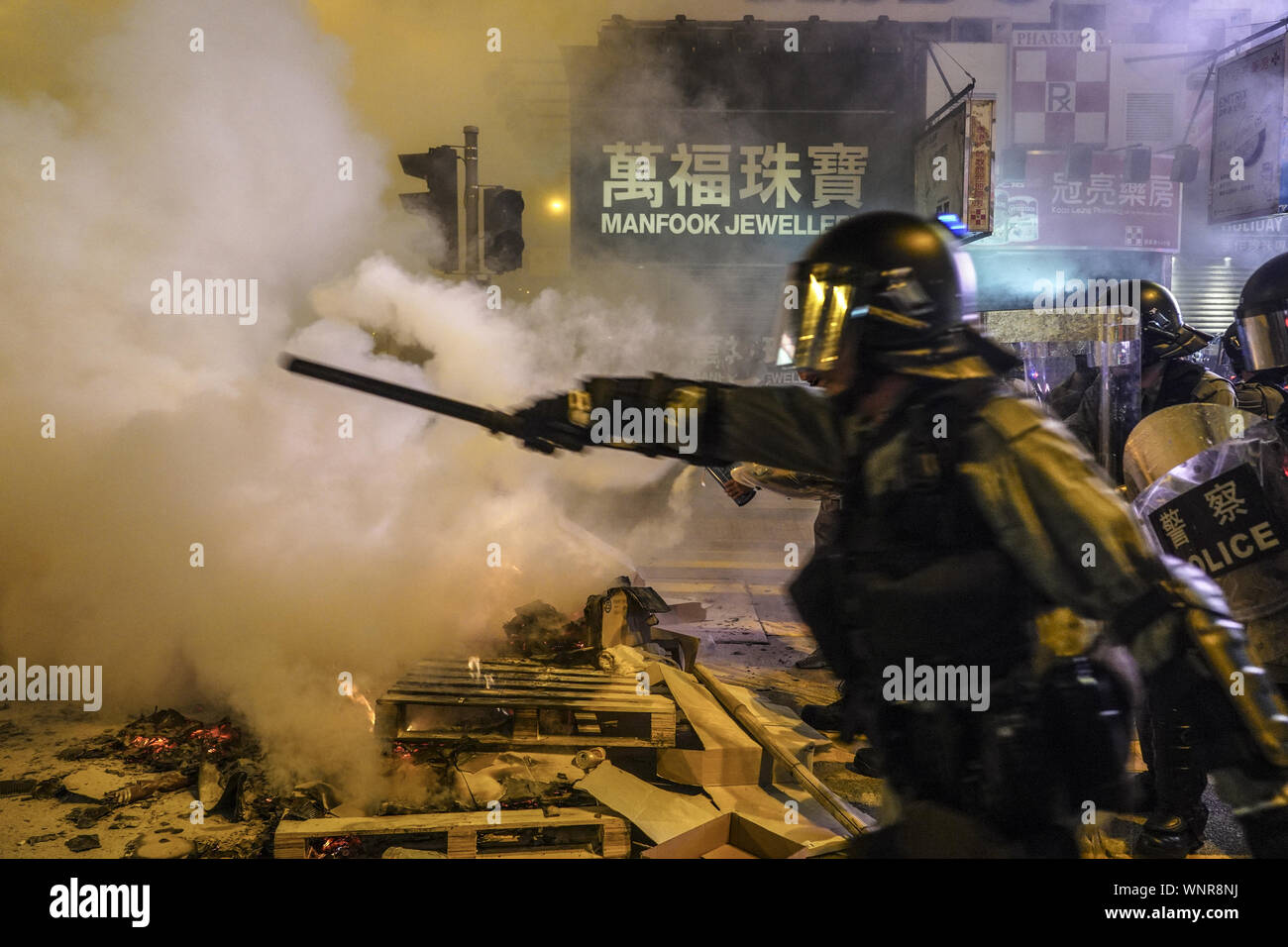 Kowloon, Hong Kong. 6th Sep, 2019. Riot Police officers advance to chase away protesters on Friday September 6, 2019 in Mong Kok Town Kowloon, Hong Kong.Thousands of protestors gathered outside of Mong Kok police station and around that area to protest the police violence against citizens of Hong Kong.Protesters Moved Nathan Rd to south, destroying surveillance cameras, street signs, building barricades with wooden panes and garbages then set on fire as they move on.9/6/2019.Kowloon, Hong Kong. Credit: ZUMA Press, Inc./Alamy Live News Stock Photo