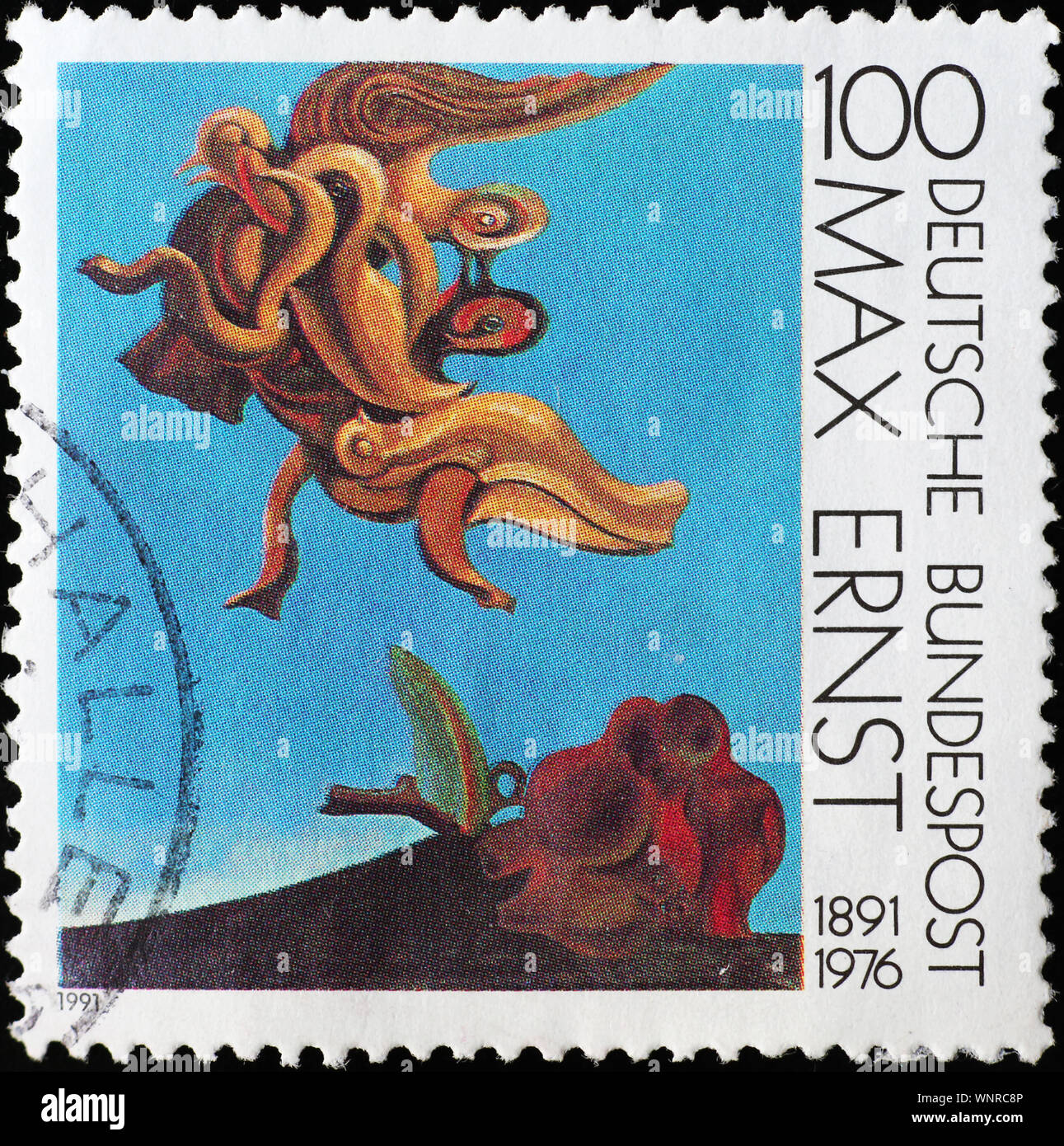 Painting by Max Ernst on french postage stamp Stock Photo