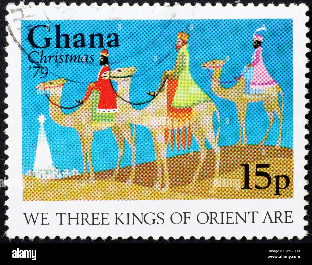 Three kings on camels in postage stamp Stock Photo