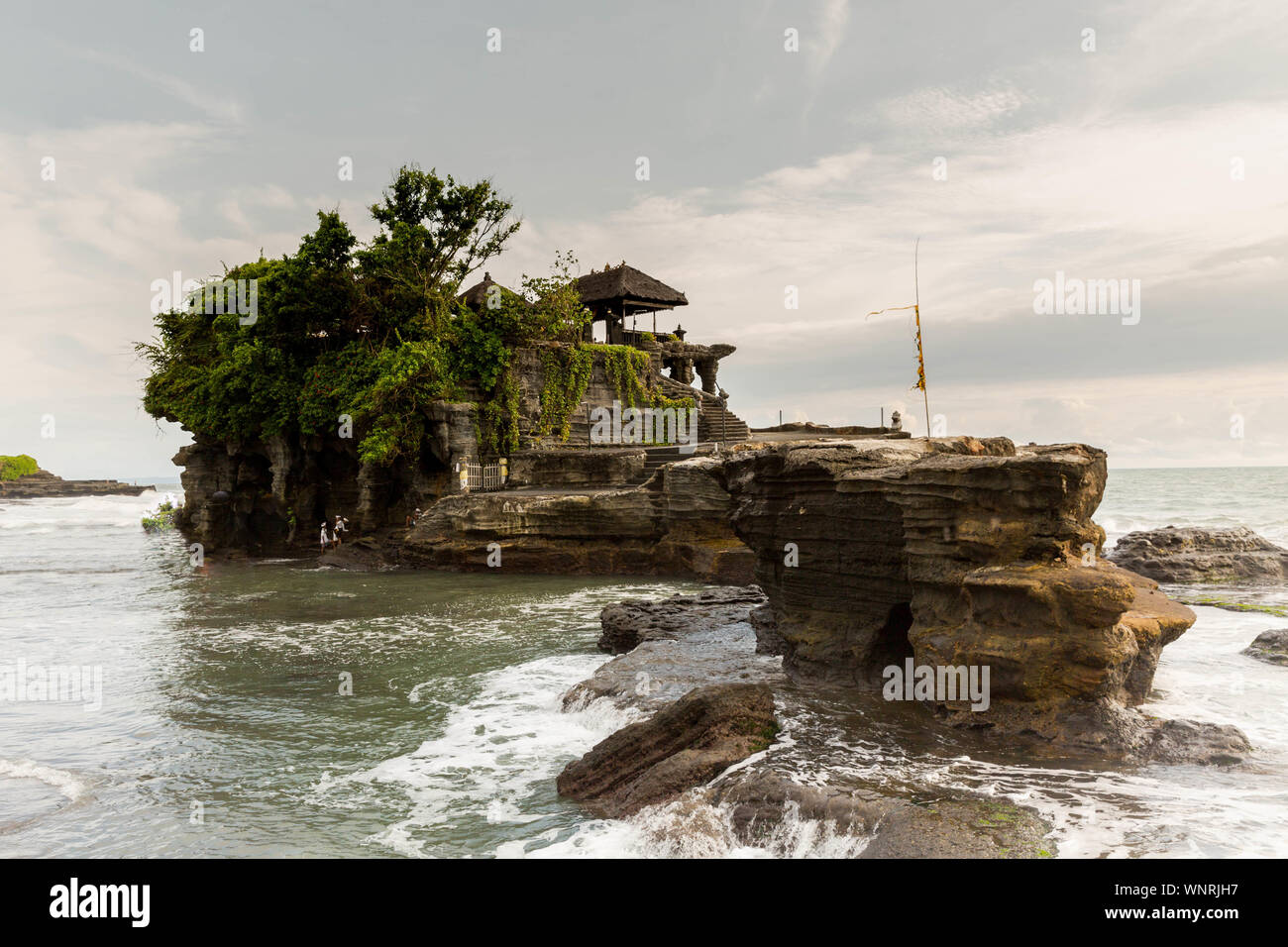 Built Structure On Cliff By Sea Against Sky Stock Photo