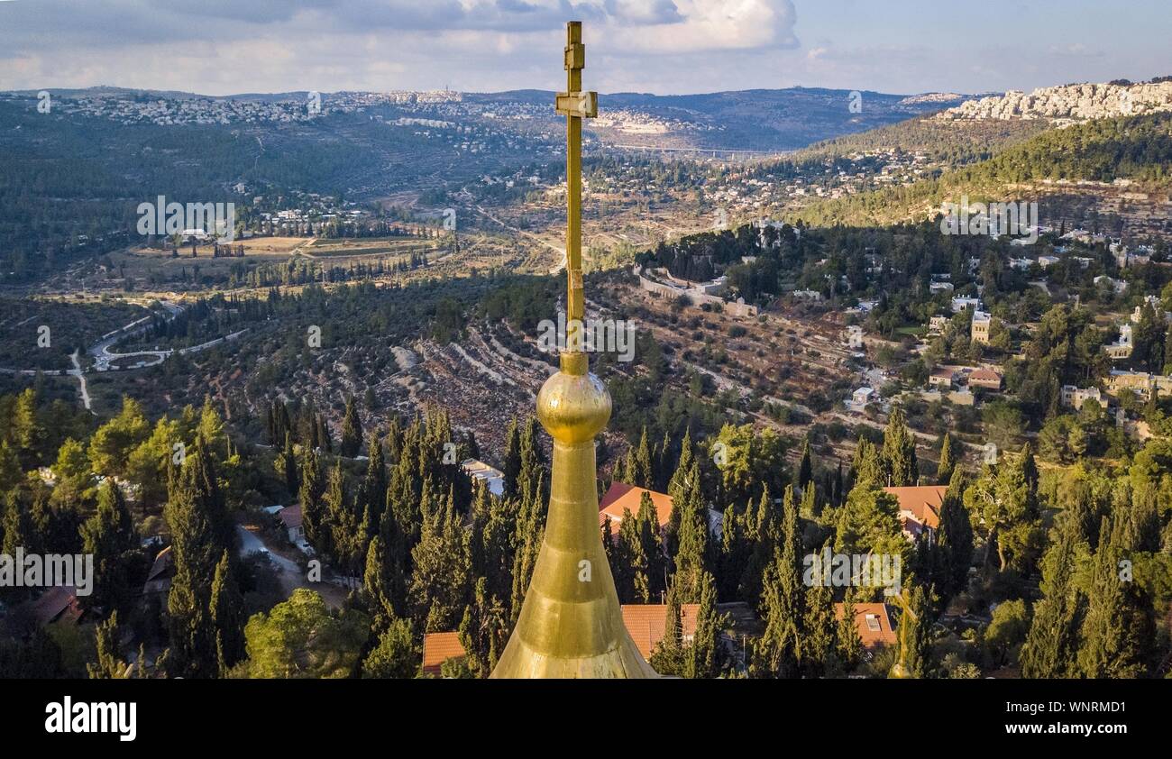 View Of Religious Cross Against Scenery Stock Photo