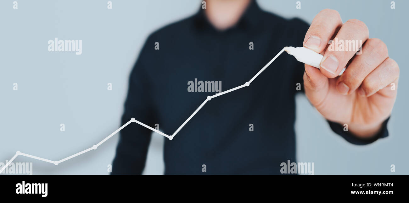 businessman drawing growth curve, growth forecast chart, bussiness success concept Stock Photo