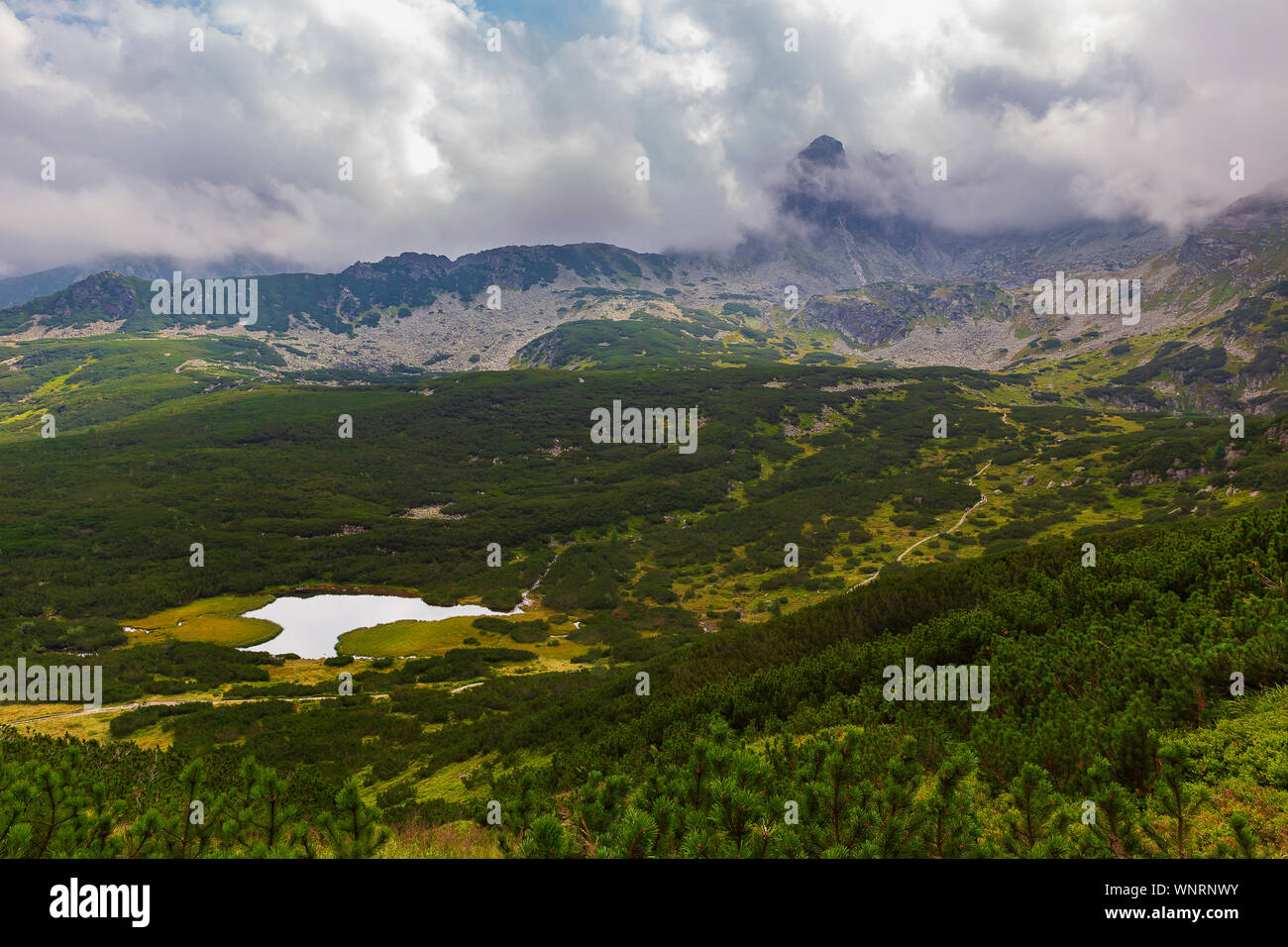 Tatra mountains in the clouds at sunset Stock Photo - Alamy