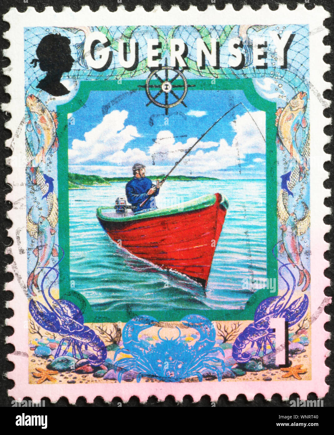 Fisherman of Guernsey on postage stamp Stock Photo