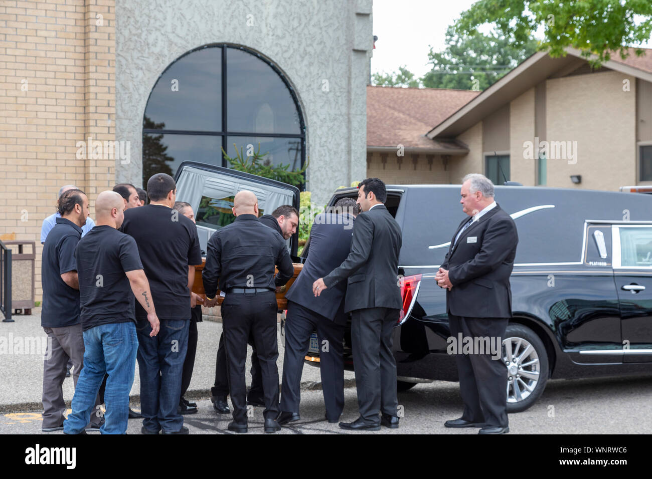 Southfield, Michigan - The casket of Jimmy Aldaoud is loaded into a hearse after his funeral at Mother of God Chaldean Catholic Church. Aldaoud, 41, w Stock Photo