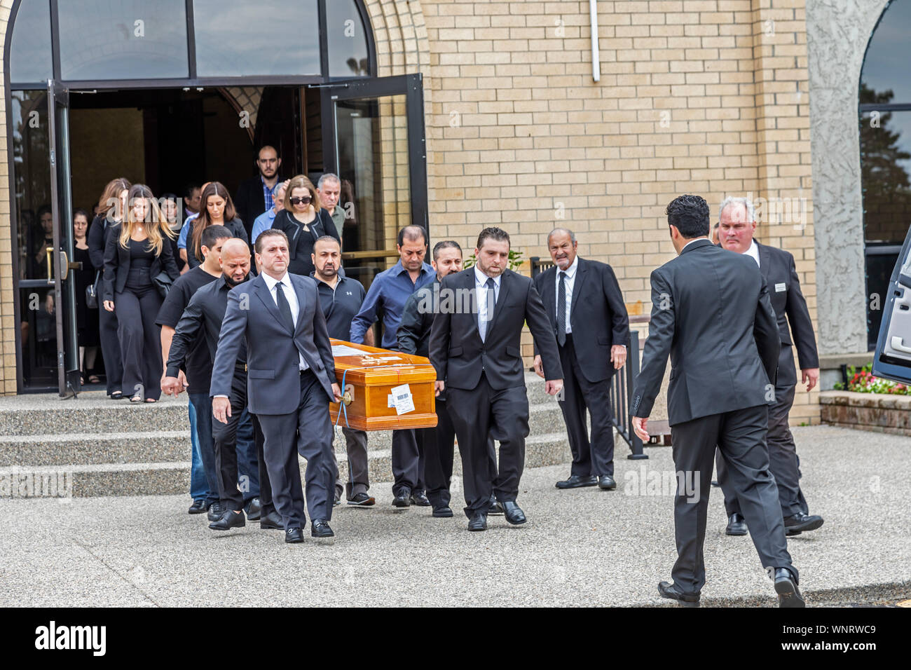 Southfield, Michigan - Jimmy Aldaoud's casket is carried into Mother of God Chaldean Catholic Church for funeral services. Aldaoud, 41, was deported f Stock Photo