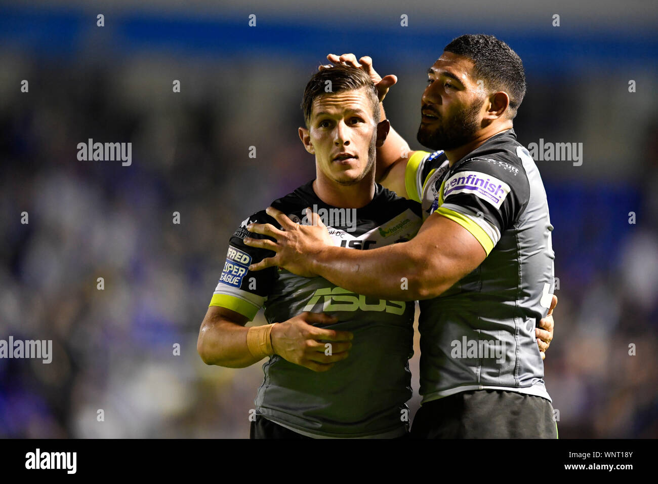 6th September 2019; Halliwell Jones Stadium, Warrington, Lancashire, England; Betfred Super League Rugby, Warrington Wolves versus Wakefield Trinity; Kelepi Tanginoa of Wakefield Trinity consoles Morgan Escare after their 23 - 16 defeat to Warrington Wolves - Editorial Use Only. Stock Photo