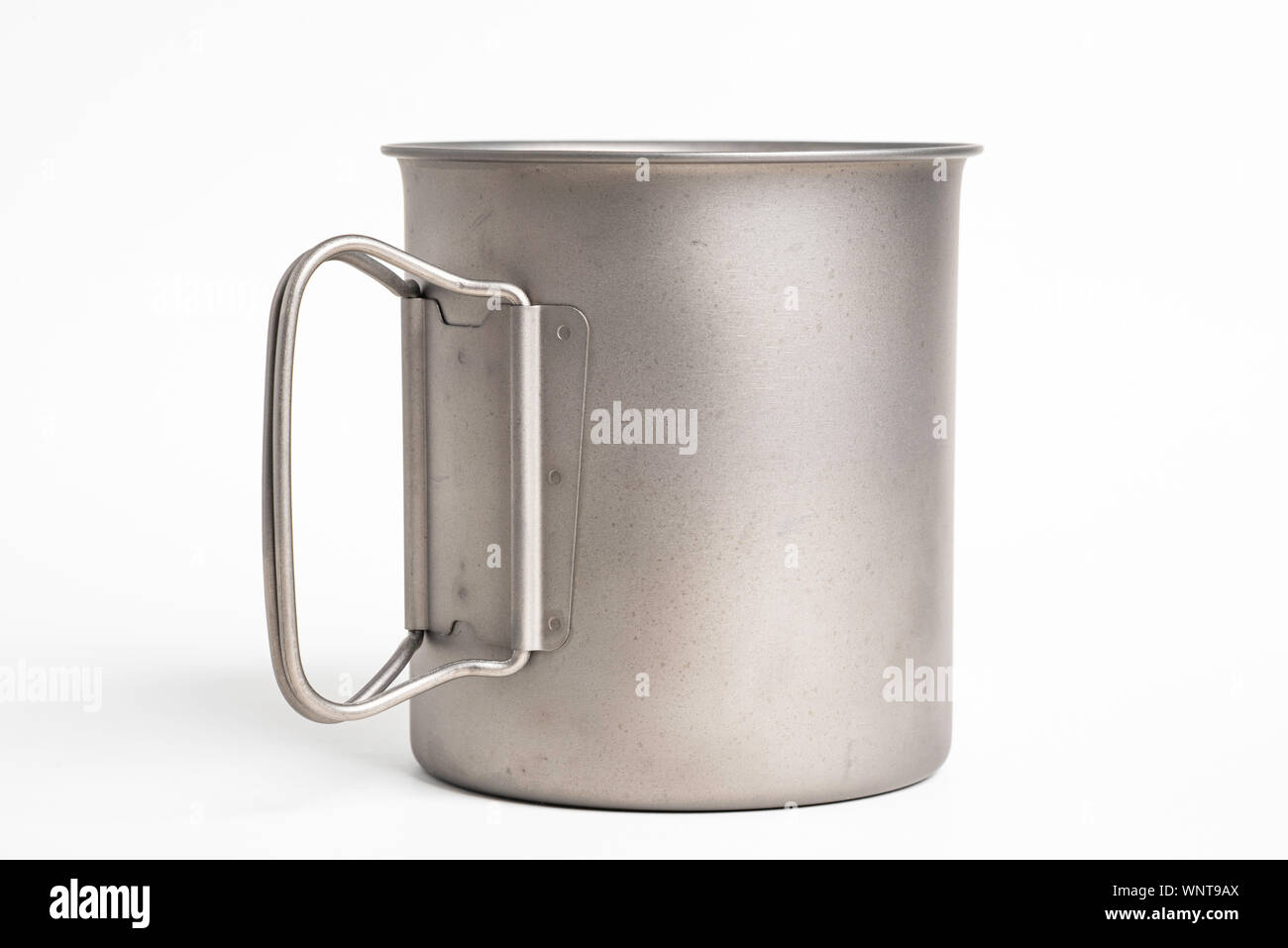 https://c8.alamy.com/comp/WNT9AX/an-all-metal-multiple-purpose-mug-with-flexible-handle-and-measuring-mark-set-on-a-plain-white-background-WNT9AX.jpg