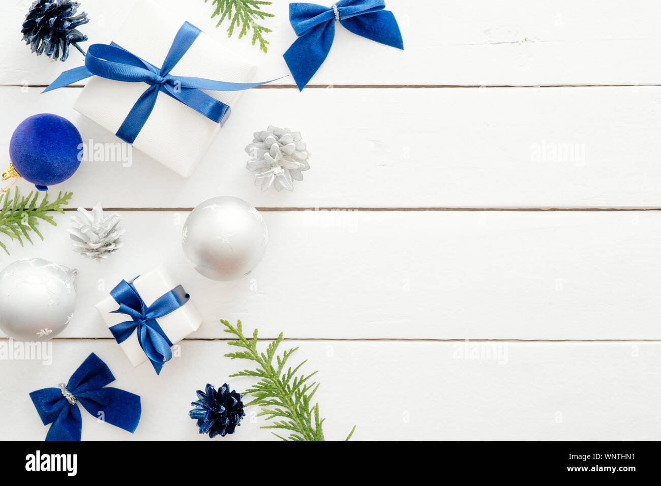Christmas card template with blue balls, gift boxes, ornaments on ...