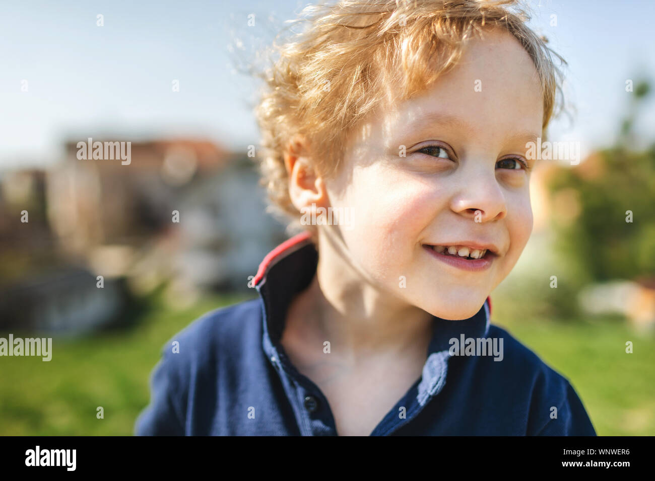 Portrait of young boy smiling Stock Photo - Alamy