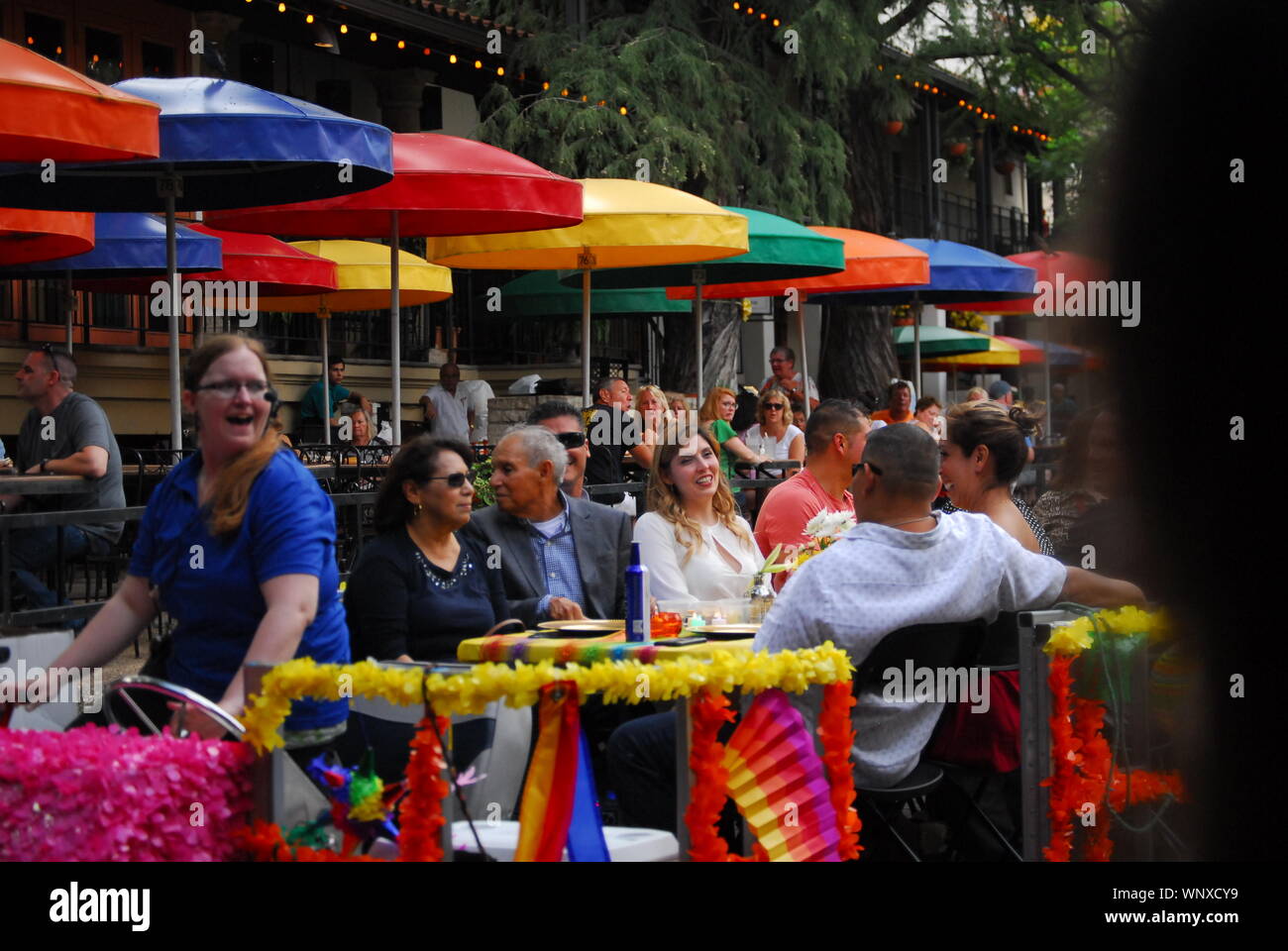 People at an outdoor restaurant at the Riverwalk in San Antonio,Texas. Stock Photo