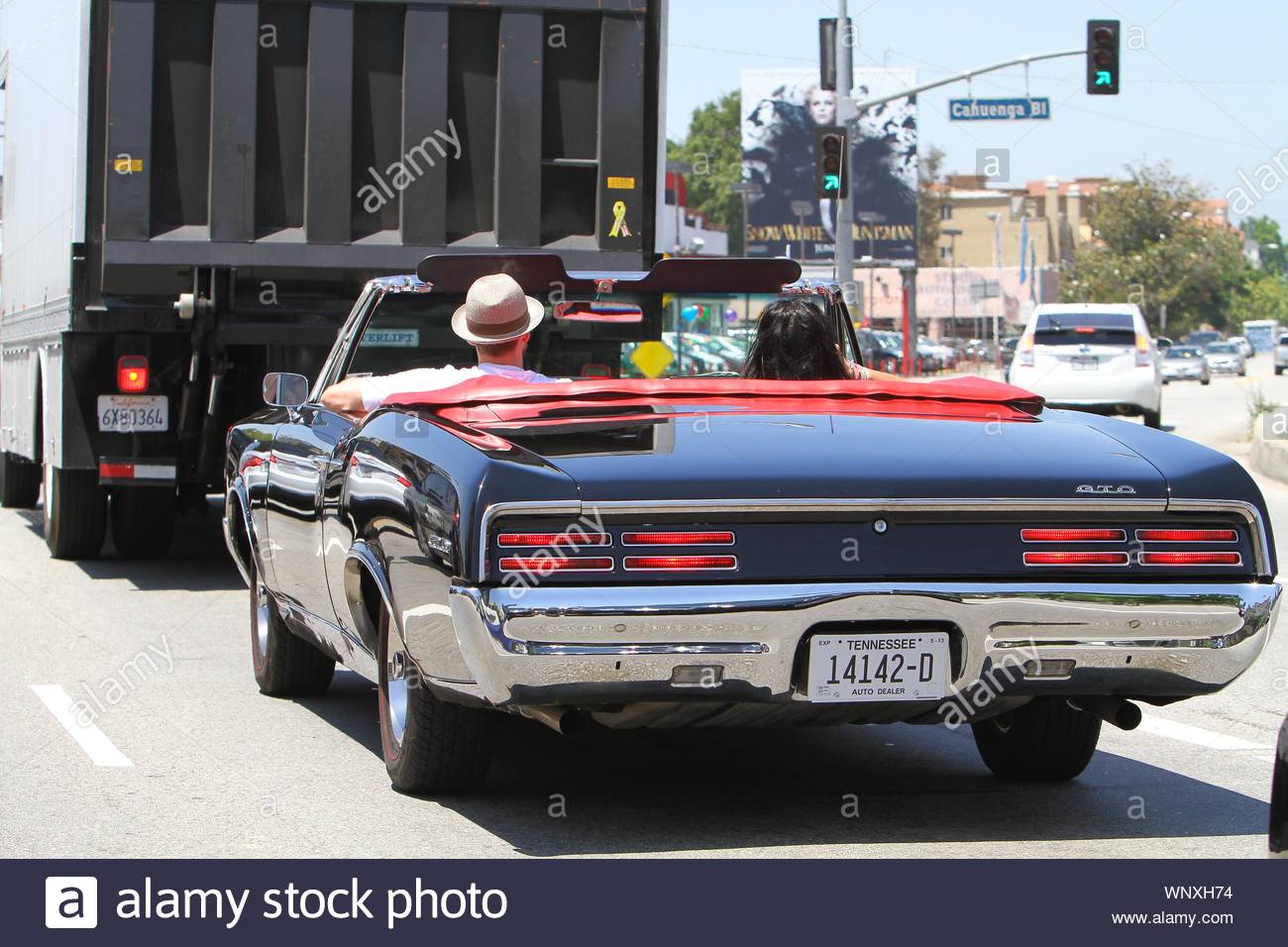 los-angeles-ca-justin-timberlake-was-out-and-about-today-in-los-angeles-cruising-along-in-his-pontiac-gto-with-a-mystery-lady-before-exiting-the-car-justin-looked-over-at-the-pretty-brunette-and-walked-away-as-the-mystery-woman-smiled-for-the-camera-before-exiting-the-car-herself-akm-gsi-may-22-2012-WNXH74.jpg