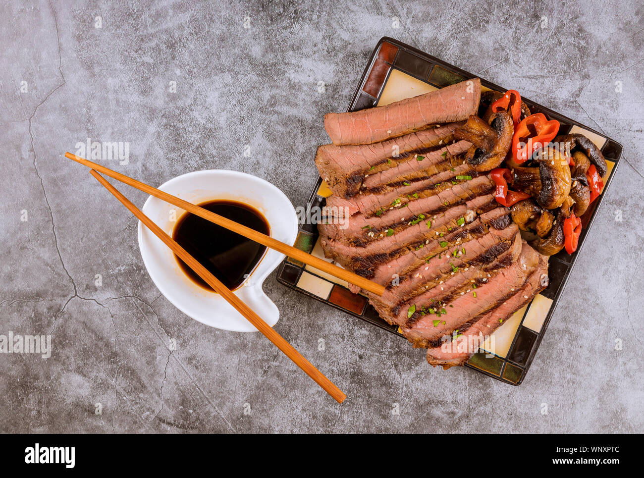 Korean sweet fried beef and mushrooms, toasted sesame seeds, soy sauce