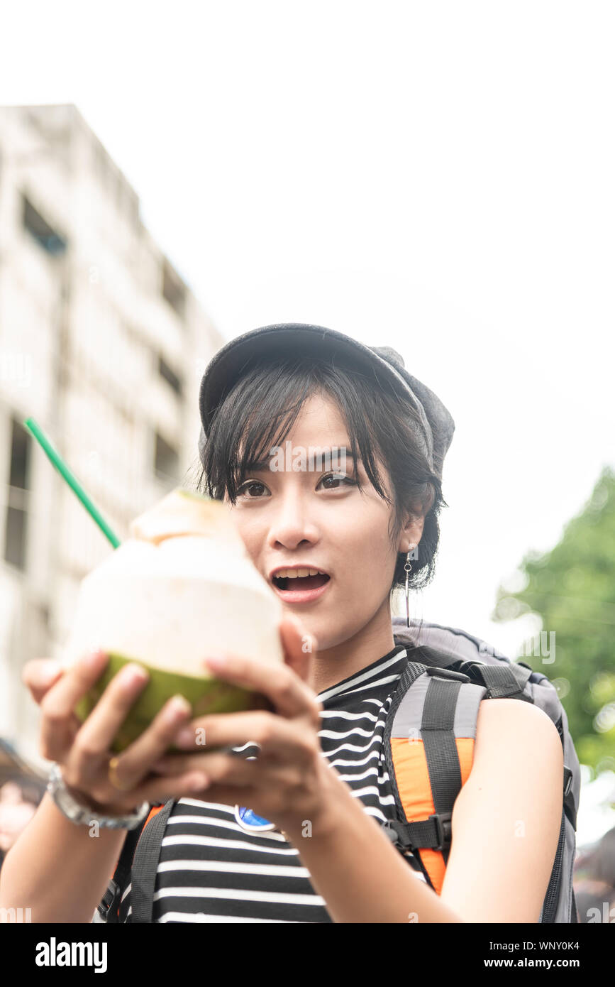 Young Asian cute woman traveler tourist shopping walking on the famous