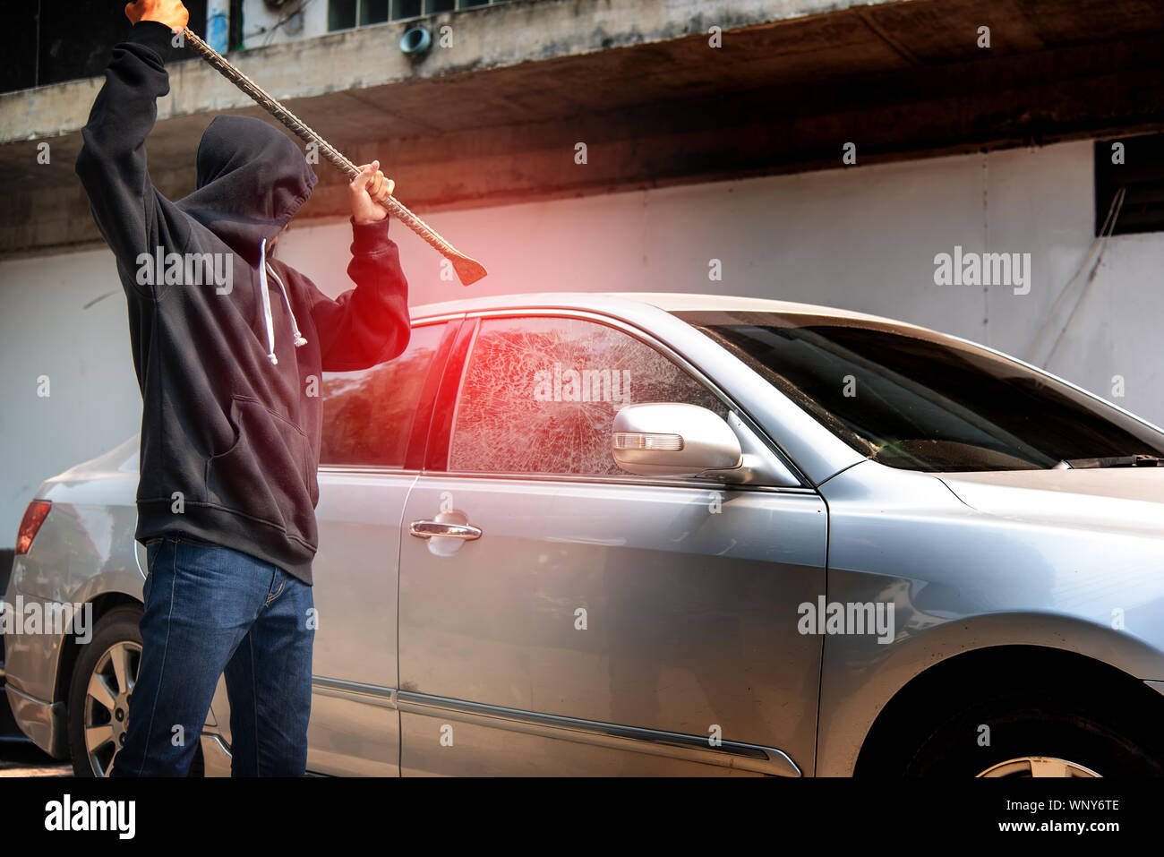 Car Thief Stealing To Break Glass Into A Car Masked Hide Face Man Robber Dressed In Black Holding Crowbar Into Car Damage Glass Window Of Car Stock Photo Alamy