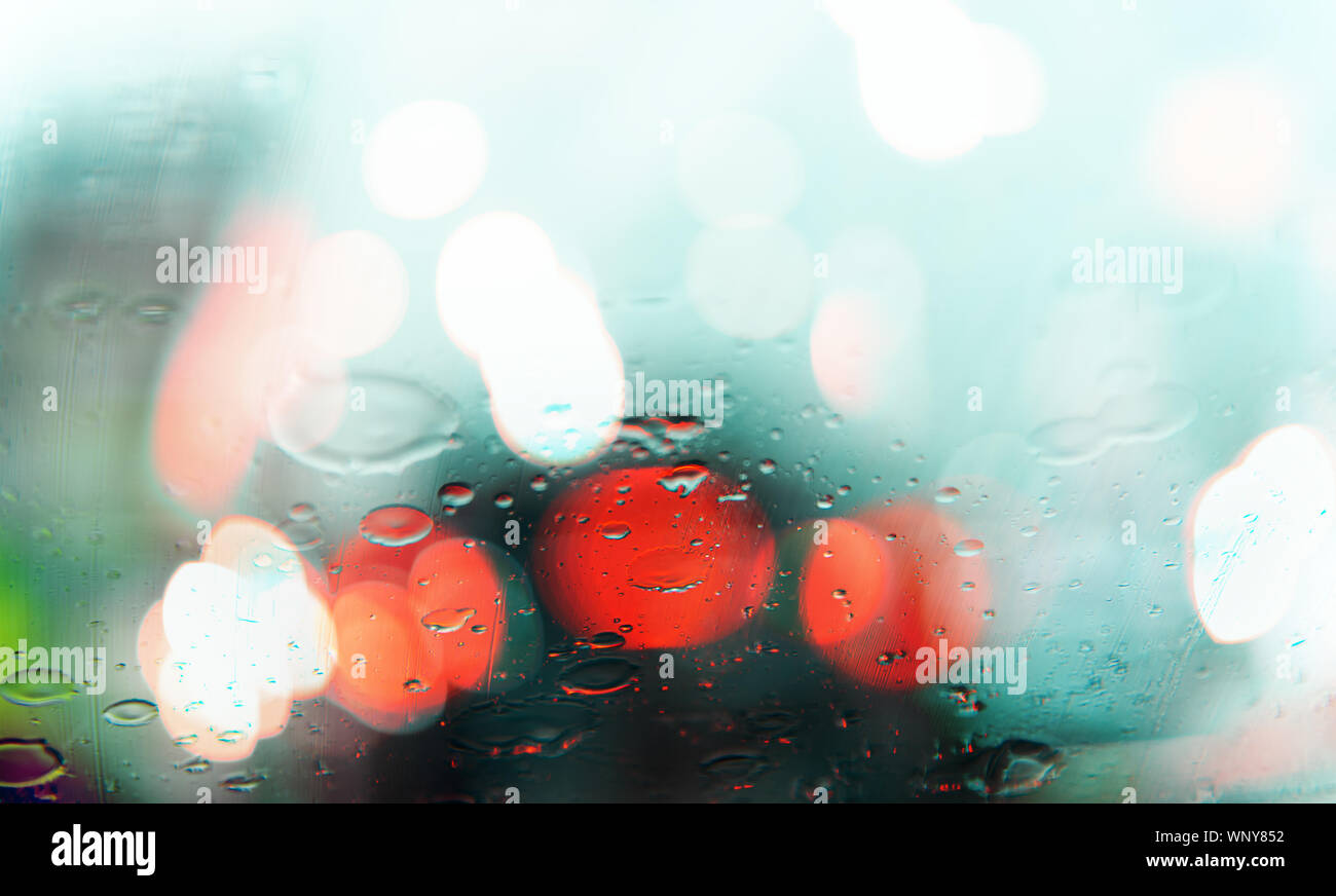 Abstract blurred of traffic jam with rain drops on window ,rain and ...