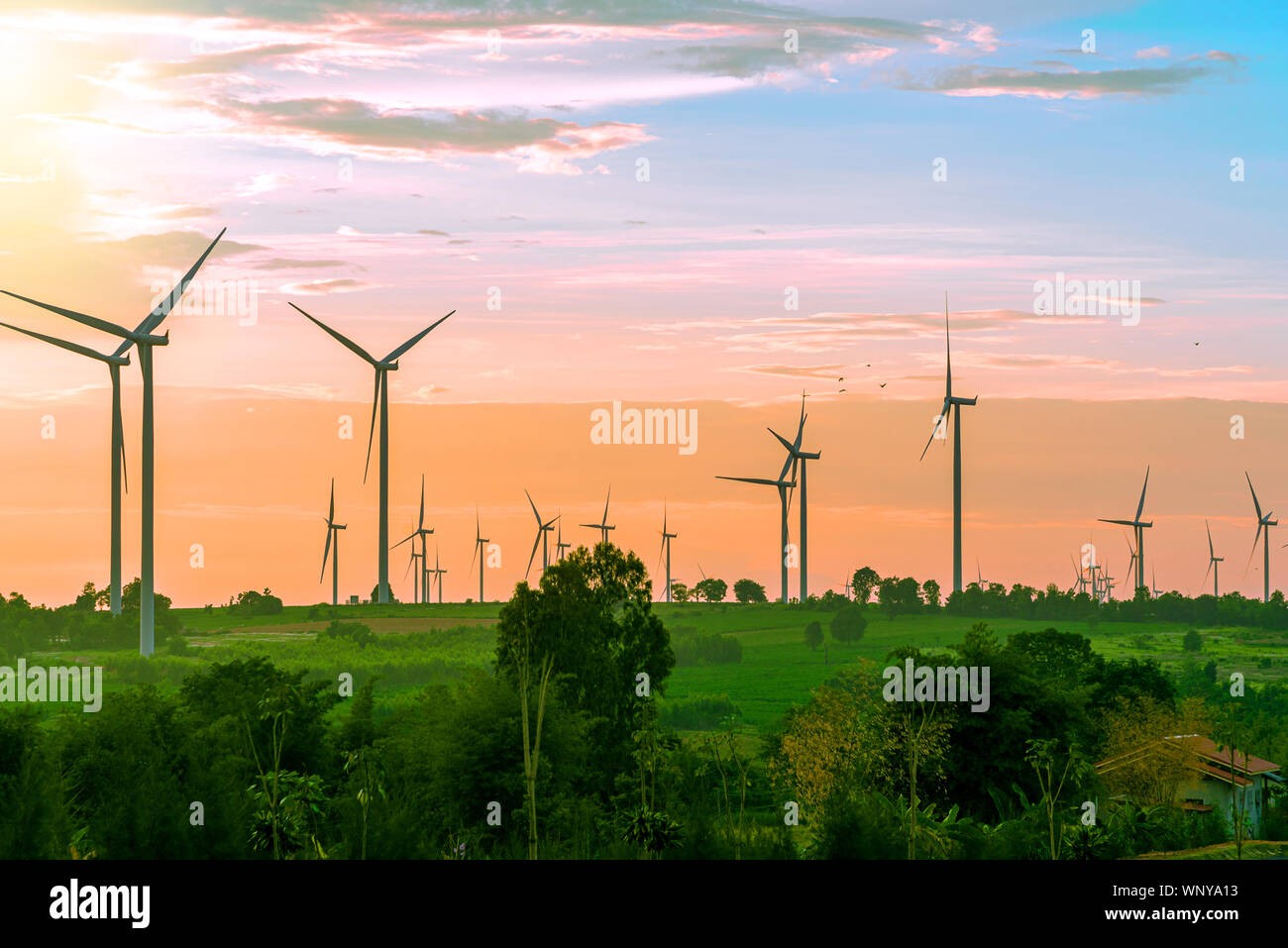 Landscape of farm big wind turbines which alternative energy innovation for production electricity energy from wind .Energy renewable energy saving en Stock Photo
