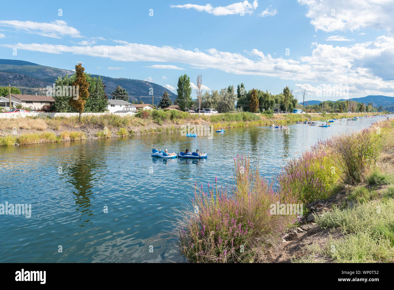 Inner tube floating down river hires stock photography and images Alamy