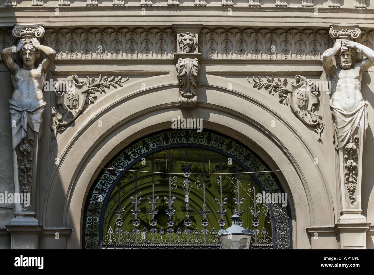 Bucharest, Romania - August 08, 2018: The monumental portal with statues from the entrance to the Macca-Vilacrosse Passage, built in 1891, from Doamne Stock Photo