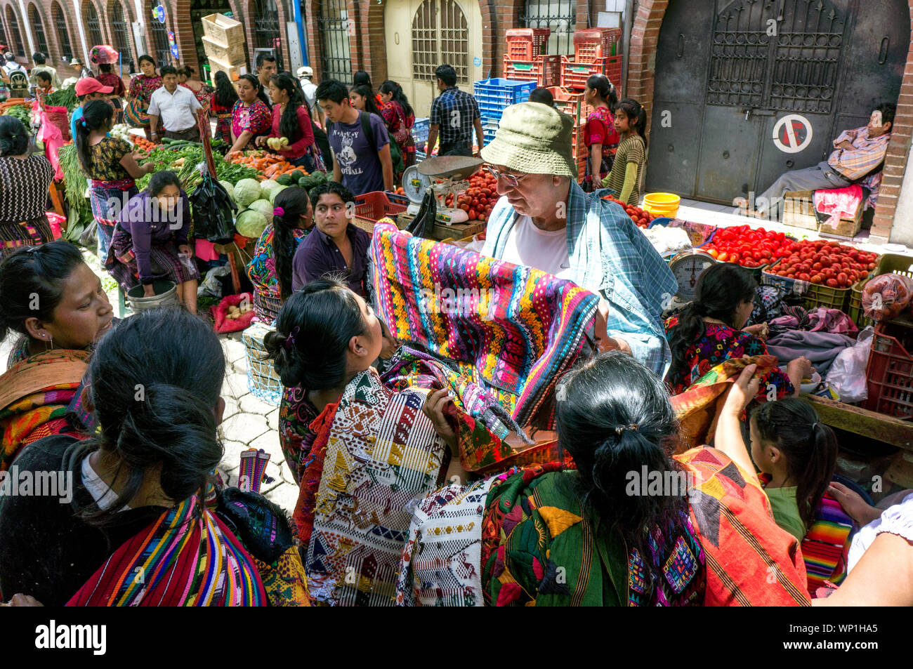Mayan Women Sell Textiles to Tourists at the Street Market in Chichicastenango, Guatemala Stock Photo