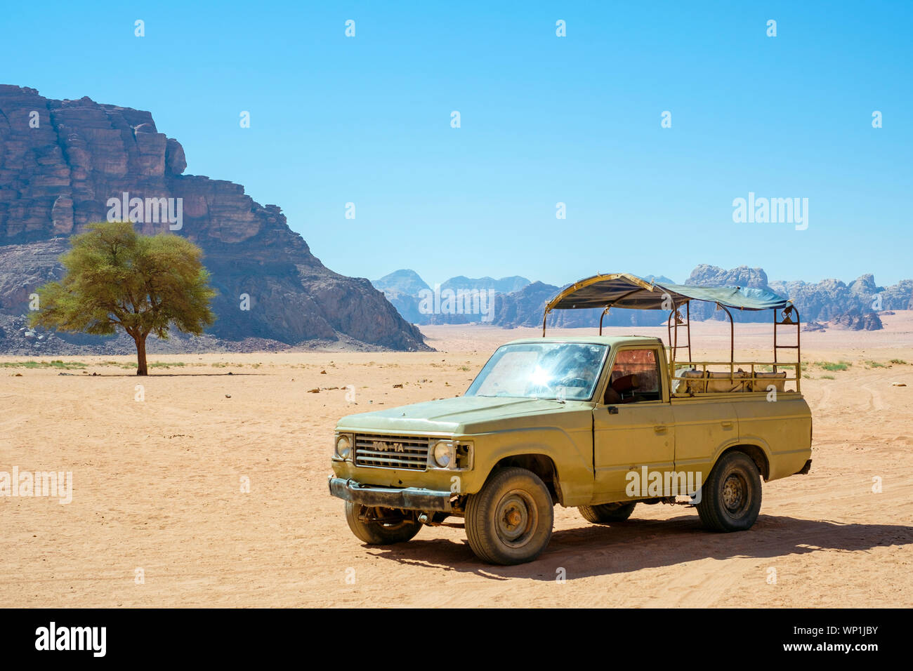 Jordan, Aqaba Governorate, Wadi Rum. Wadi Rum Protected Area, UNESCO World Heritage Site. Four wheel drive truck belonging to local bedouin guide. Stock Photo