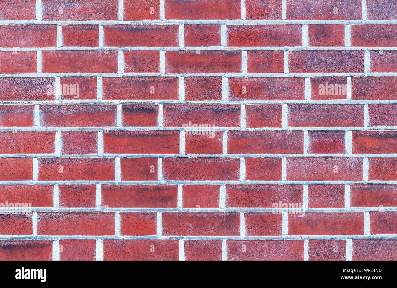 A red brick wall in sunlight with light colored mortar Stock Photo Alamy