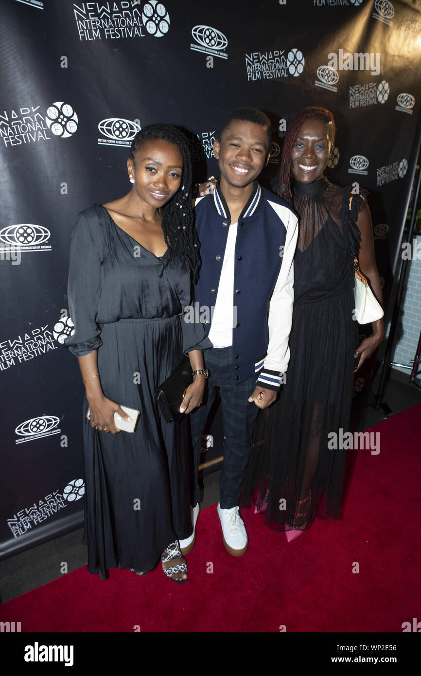 Newark, New Jersey, USA. 6th Sep, 2019. From left PATIENCE MPUMLWANA (mother), JHAMELA MPUMLWANA ('Star Trek Discovery'' actor) and CARLEEN ROBINSON ( Business partner) appear during the red carpet event for 'Business Ethics'' premiere featuring Lorenz Tate at the Newark Cineplex 12 movie theatre of the fourth annual Newark International Film Festival (NewarkIFF) in Newark, New Jersey. The festival runs from September 4th and ends September 9, 2019 with an awards ceremony at the Newark Museum. Credit: Brian Branch Price/ZUMA Wire/Alamy Live News Stock Photo