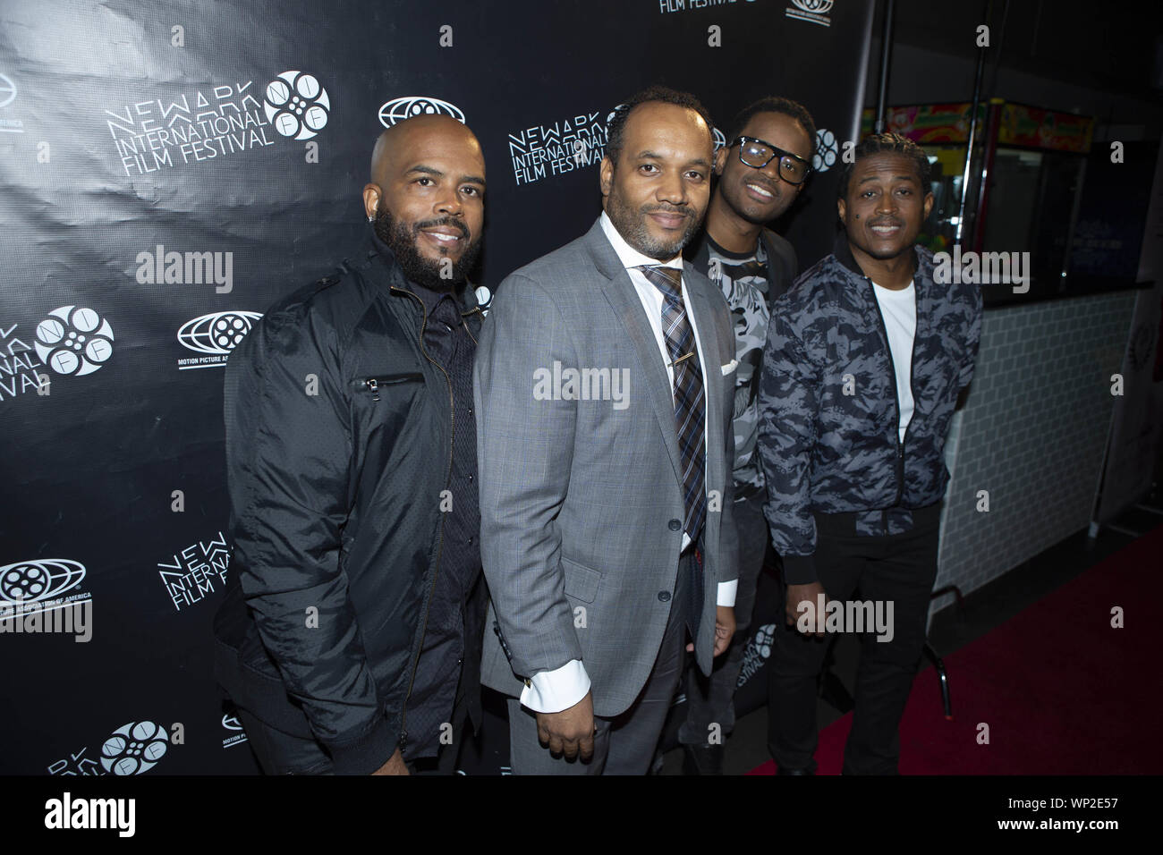 Newark, New Jersey, USA. 6th Sep, 2019. Left, actor LAHMARD TATE, KENNETH GIFFORD, founder the Newark International Film Festival, LARENZ TATE, actor, LARRON TATE, actor appear during the red carpet event for 'Business Ethics'' premiere at Newark Cineplex 12 during the fourth annual Newark International in Newark, New Jersey. The festival runs from September 4th and ends September 9, 2019 with an awards ceremony at the Newark Museum. Credit: Brian Branch Price/ZUMA Wire/Alamy Live News Stock Photo