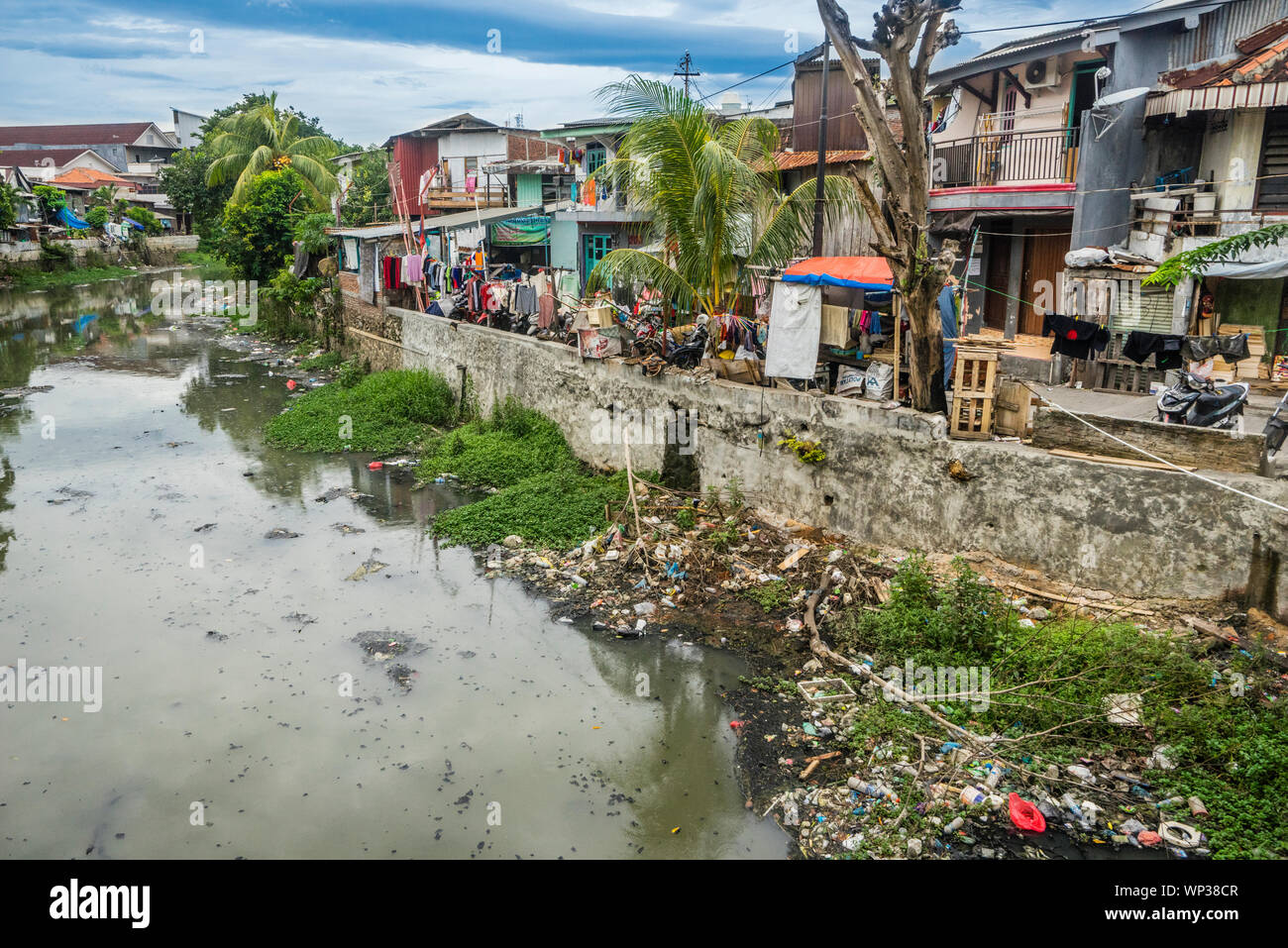 Badly polluted Semarang River at Semarang Chinatown, Central Java, Indonesia Stock Photo