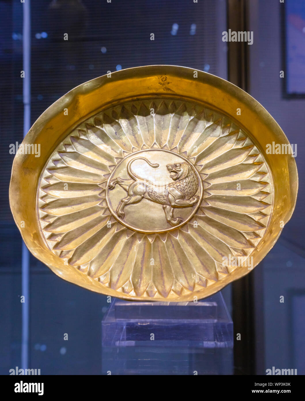 Plate with rampant lion, gold, 5th century BC, Reza Abbasi Museum, Tehran, Iran Stock Photo