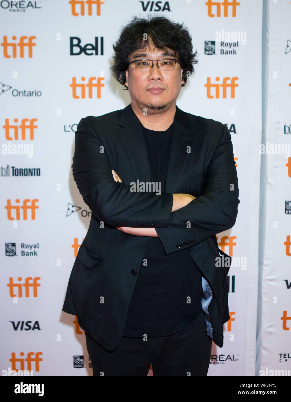 Toronto, Canada. 6th Sep, 2019. Director Bong Joon-ho poses for photos before the Canadian premiere of the film 'Parasite' at Ryerson Theatre during the 2019 Toronto International Film Festival (TIFF) in Toronto, Canada, Sept. 6, 2019. Credit: Zou Zheng/Xinhua Stock Photo